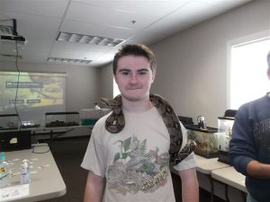 Dakotah Henn and his pet snake (courtesy of D. Henn). 