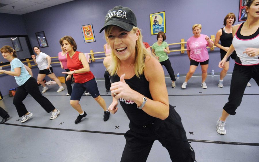 Zumba instructor Shawn Schmitt, 44, of Allentown, Pennsylvania leads her class. Zumba is a new group fitness trend that offers a Latin-American inspired workout. Zumba, which is Colombian slang for fast,  mixes traditional Latin dances like salsa and merengue with cardiovascular moves in more traditional aerobic classes. (Monica Cabrera/Allentown Morning Call/MCT)
