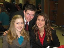 Seniors Lauren Simik, Brandon Becko, and Irina Tuluca (left to right) are all smiles before competing in the Geneso Tournament.