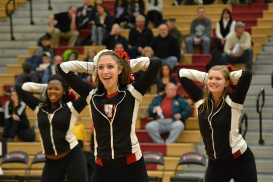 Girls from the varsity pom team perform their hip hop routine during half time (M. Krebs).