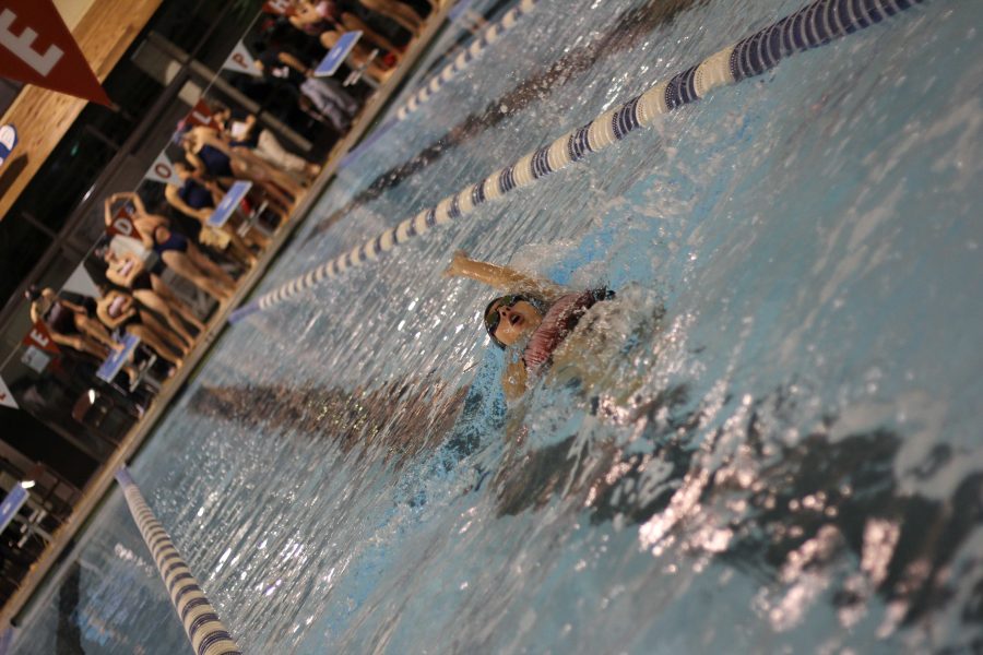 Girls swimming kicks onward