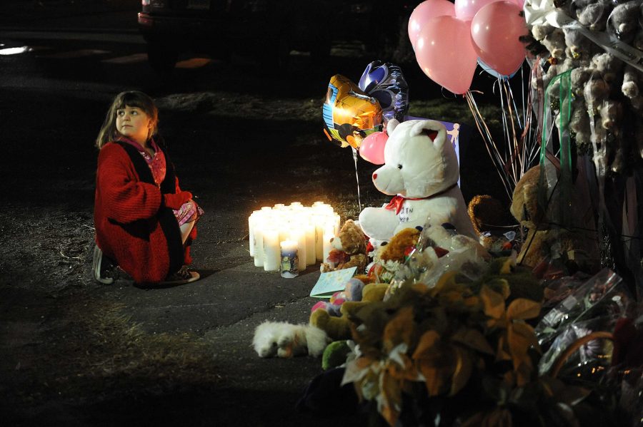 Candles are lit at a memorial near Sandy Hook Elementary School. (Olivier Douliery/Abaca Press/MCT)