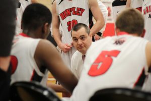 Coach Martin Manning speaks with his players during a timeout. Mike Krebs/ The Voice