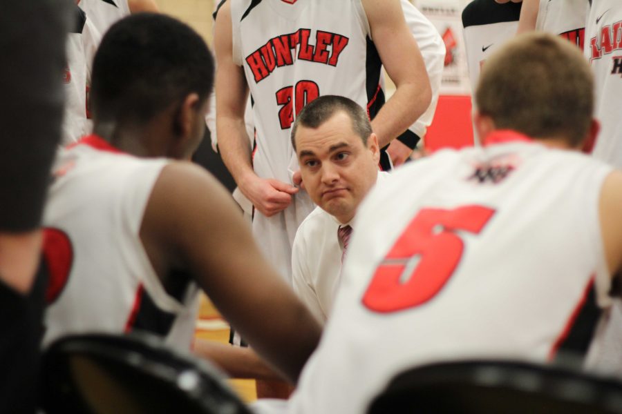 Coach+Martin+Manning+speaks+with+his+players+during+a+timeout.+Mike+Krebs%2F+The+Voice