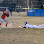 Third baseman Tyler Albright tags out a runner trying to steal third.