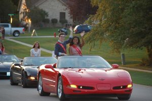 Junior Homecoming representatives Jess Clavero and Spencer Bingham ride down the parade route in style. Photo courtesy of Jess Clavero. 