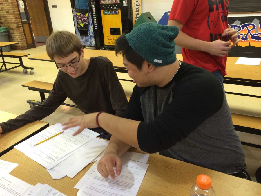 Math Team members Jeff Chan and James Cannalte discuss a problem after their individual competition.