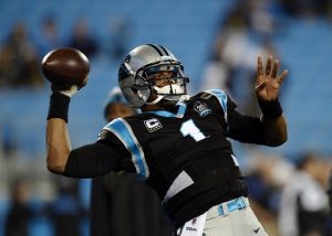 Cam Newton throws a pass against the Saints (MCT Campus)