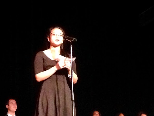 Claudine Garcia inducting a new member to NHS (C. Walsh)