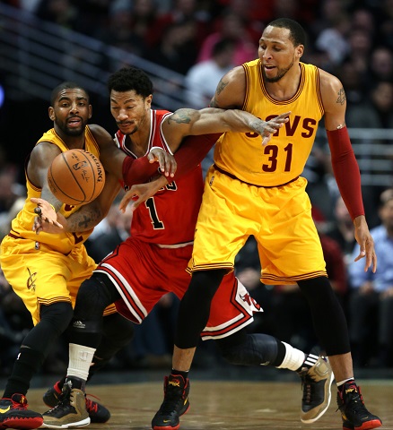 The Chicago Bulls Derrick Rose (1) fights through the Cleveland Cavaliers Kyrie Irving (2) and Shawn Marion (31) in the first half at the United Center in Chicago on Thursday, Feb. 12, 2015. The Bulls won, 113-98. (Chris Sweda/Chicago Tribune/TNS)