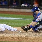The New York Mets' Juan Lagares, left, scores on a sacrifice fly before the tag of Chicago Cubs catcher Miguel Montero in the seventh inning during Game 1 of the NLCS on Saturday, Oct. 17, at Citi Field in New York. The Mets won, 4-2. (Brian Cassella/Chicago Tribune/TNS)