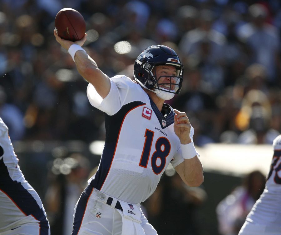 Denver Broncos quarterback Peyton Manning (18) throws during the third quarter on Sunday, Oct. 11, 2015, at O.co Coliseum in Oakland, Calif. (Nhat V. Meyer/Bay Area News Group/TNS)