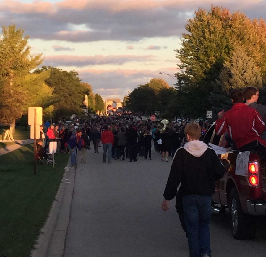 Students involved in clubs and sports show off their Huntley pride at the annual Homecoming Parade.