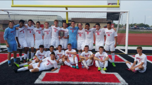 The Huntley boys soccer team celebrating after winning the 2015 Huntley Invite. (courtesy of @huntleysoccer)