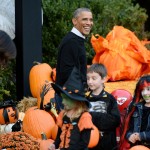 U.S. President Barack Obama and first lady Michelle Obama give out treats to children on the South Lawn of the White House, Oct. 31, 2014 in Washington, D.C. President Obama and First Lady Michelle Obama welcomed local children and children of military families to trick-or-treat for Halloween. (Olivier Douliery/Abaca Press/MCT)