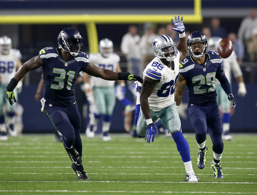 Dallas Cowboys wide receiver Dez Bryant (88) cant reach a deep ball as Seattle Seahawks strong safety Kam Chancellor (31) and Seattle Seahawks Earl Thomas (29) defend late in the second half on Sunday, Nov. 1, 2015, at AT&T Stadium in Arlington, Texas. (Brad Loper/Fort Worth Star-Telegram/TNS)