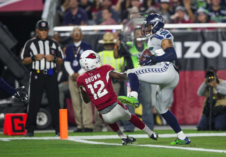 Seattle Seahawks' DeShawn Shead intercepts a pass intended for Arizona Cardinals' John Brown at the goal line during the fourth quarter on Sunday, Jan. 3, 2016, at University of Phoenix Stadium in Glendale, Ariz. (Dean Rutz/Seattle Times/TNS)