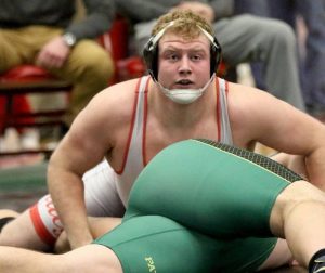 Senior Dominic Swanson works on pinning his opponent (Courtesy of Dominic Swanson).