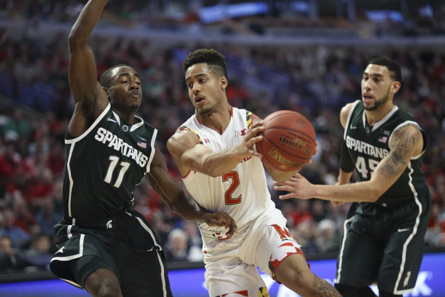 Marylands Melo Trimble (2) drives against Michigan States Lourawls Nairn Jr. (11) during the first half in the semfinals of the Big Ten Tournament at the United Center in Chicago on Saturday, March 14, 2015. Michigan State advanced, 62-58. (Armando L. Sanchez/Chicago Tribune/TNS)
