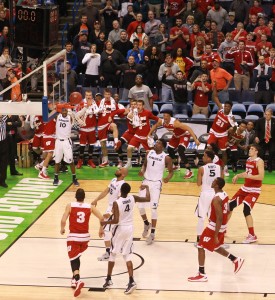All eyes are on the ball as it drops in for a game-winning three-pointer by Wisconsin guard Bronson Koenig, obscured behind backboard, as time expires during the second half on Sunday, March 20, 2016, at the Scottrade Center in St. Louis. (Chris Lee/St. Louis Post-Dispatch/TNS)