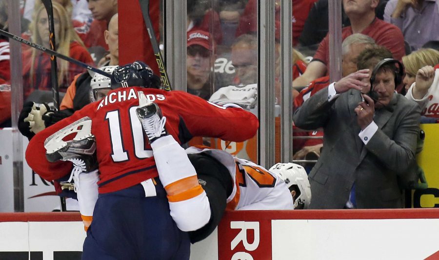 The Washington Capitals Mike Richards (10) checks the Philadelphia Flyers Nick Cousins (52) in the second period during Game 5 of the Eastern Conference quarterfinals on Friday, April 22, 2016, at the Verizon Center in Washington, D.C. (Yong Kim/Philadelphia Daily News/TNS)