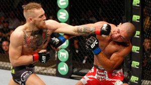 DUBLIN, IRELAND - JULY 19: (L-R) Conor McGregor lands a left to the head of Diego Brandao in their featherweight bout during the UFC Fight Night event at The O2 Dublin on July 19, 2014 in Dublin, Ireland. (Photo by Josh Hedges/Zuffa LLC/Zuffa LLC via Getty Images)