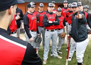 Coach Andy Jakubowski talks to his team before taking the field. The Red Raiders defeated the Indians to win their regional. (courtesy of Rick Bamman/ nwherald.com)