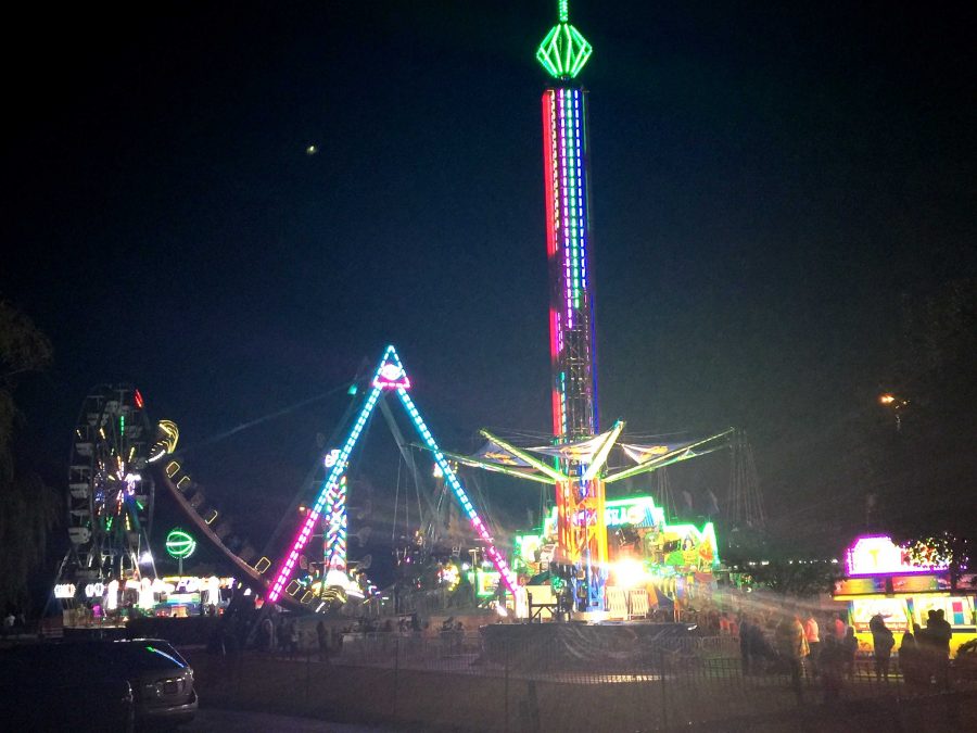 View+of+the+lit-up+Ferris+Wheel%2C+The+Zipper%2C+and+various+other+rides+at+the+Fall+Fest+%28P.+Moore%29