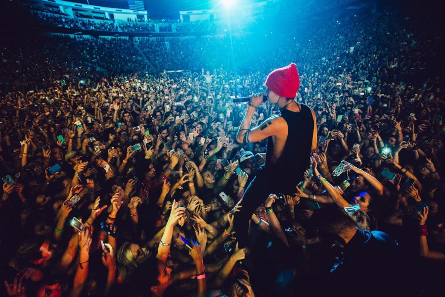 Lead singer, Tyler Joseph, joining the screaming fans as he sings one of their many hit songs (Courtesy of twenty one pilots Facebook page).