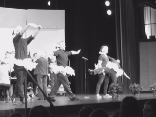 Sophomore Frank Mete along with his friends prance around the stage (S. Biernat)