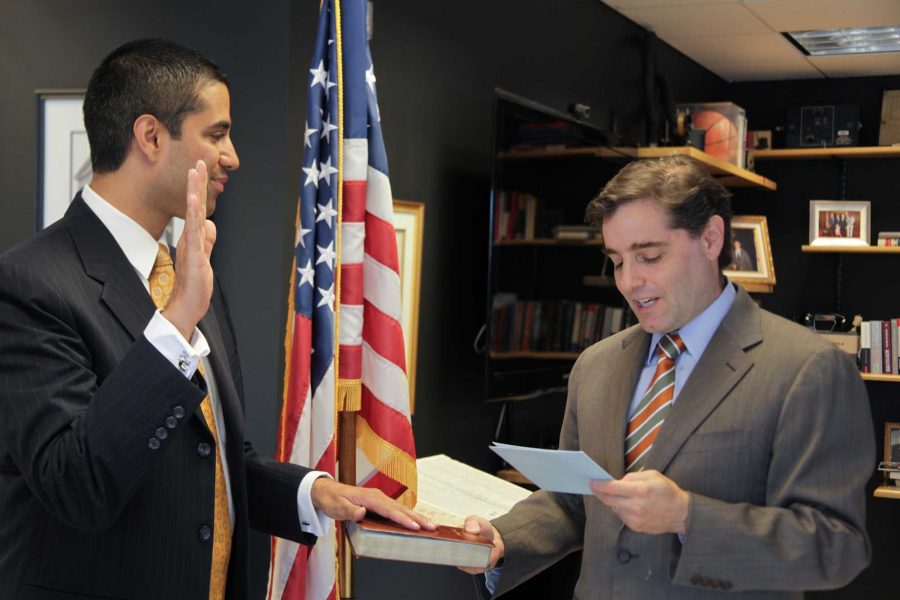 FCC Chairman Genachowski swearing in Ajit Pai as the new Commissioner at the FCC headquarters in Washington, DC.

May 14, 2012.
[Federal Communications Commission Photo]