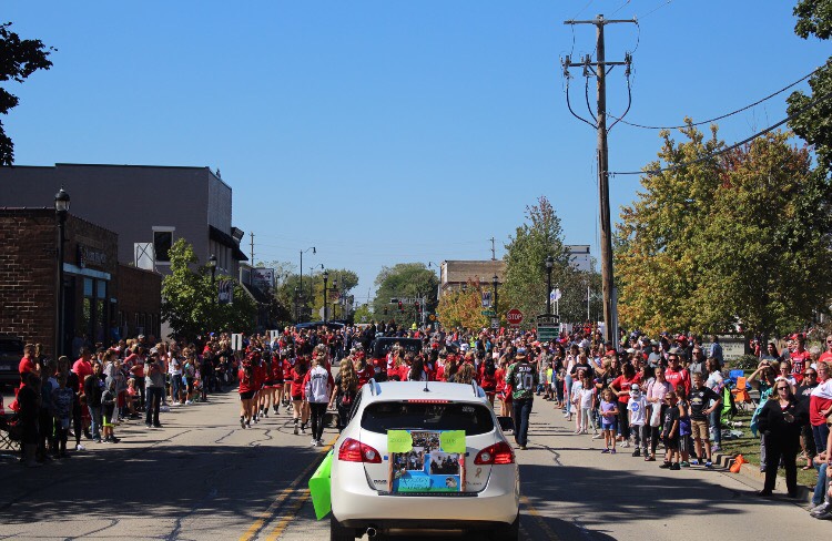 Main Street filled with Huntley families and students celebrating the start of homecoming.