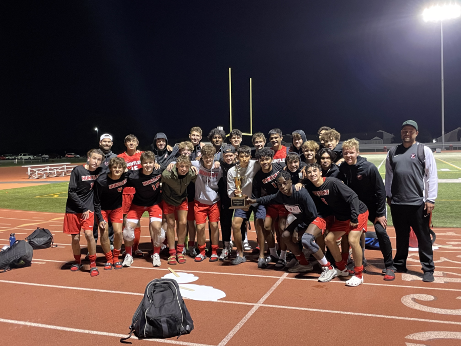 Varsity players gather to celebrate another victory during their win streak (E. McCoy)