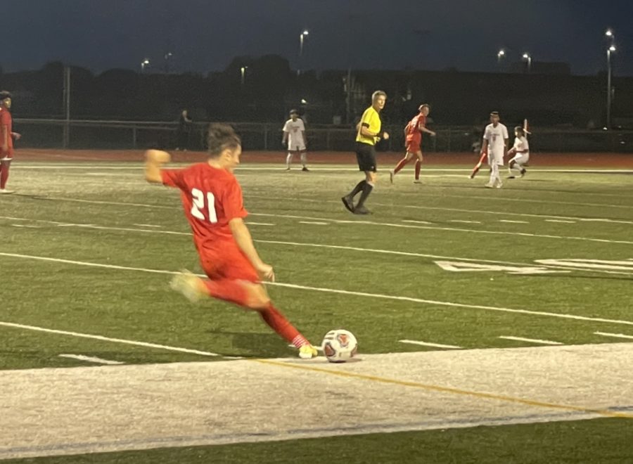 Midfielder Zach Heitkemper punts the ball downfield. (C. Keller)