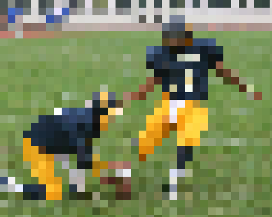 Retro Bowl kicker getting ready to kick the ball across the field (CC BY-NC 2.0)
