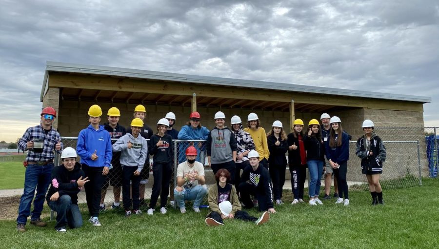 Huntley High Schools Geometry in Construction class stands in front of their most recent project.