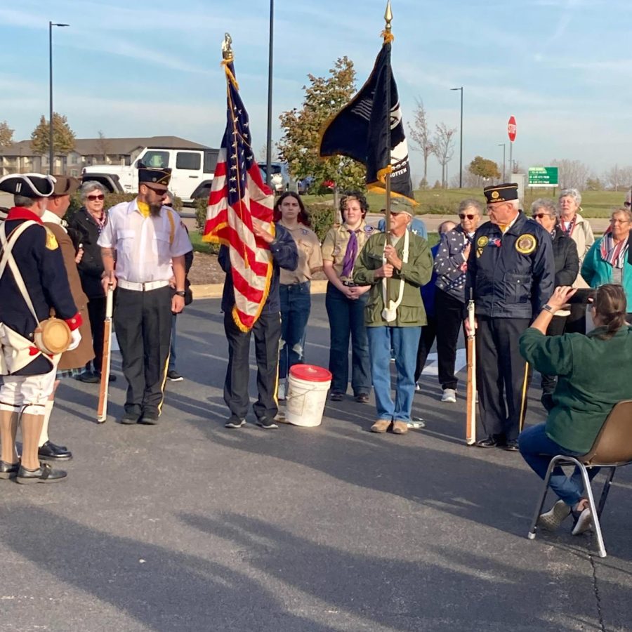 Veterans show pride with their American flags outside of the Culvers facility.