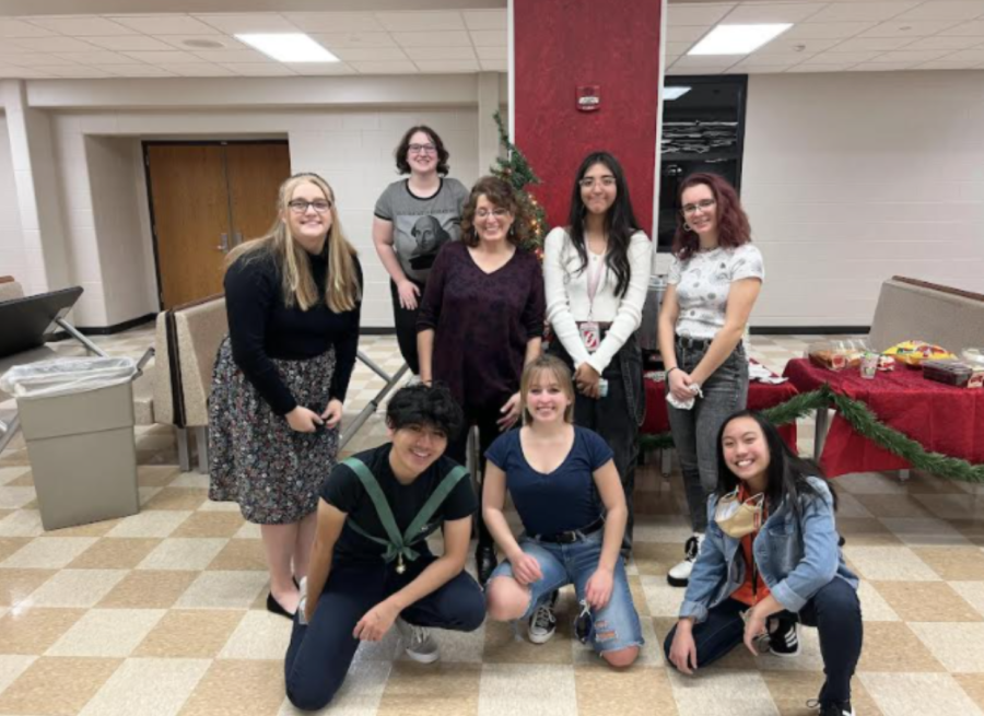 Members of the Creative Writing Club gather after successful open mic night.