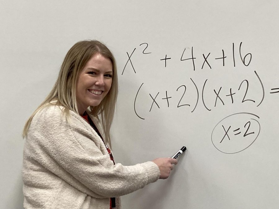 Math+teacher+Rebecca+Godez+solving+an+equation+on+the+whiteboard