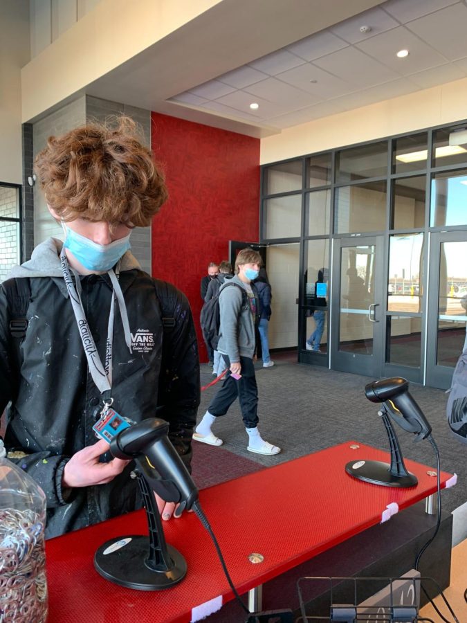 Student scans ID at door one