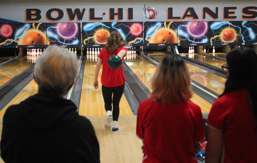 A member of the girls bowling team winds up before releasing the  ball at Bowl-Hi Lanes.