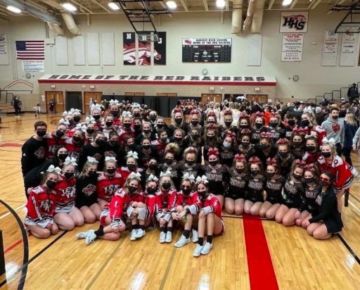 The 2 JV teams and varsity pose together at the competition. 