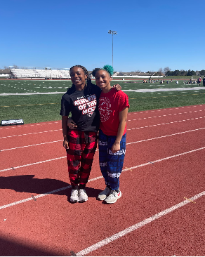 Alex and Dominique Johnson pose for a photo before practice. 