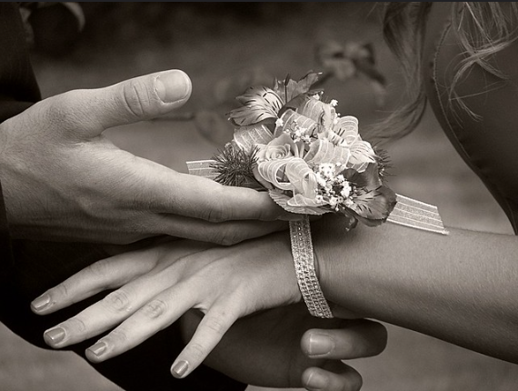 A corsage worn around the wrist, signifying the beauty of the night. 