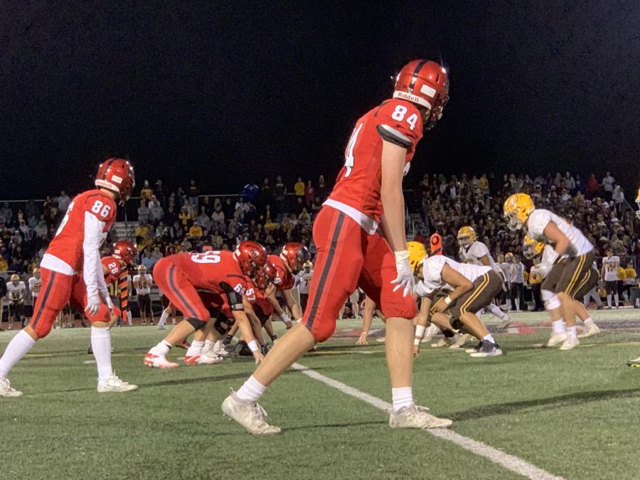 Wide receivers Jacob Witt and Connor Ardell stand beside the offensive line.