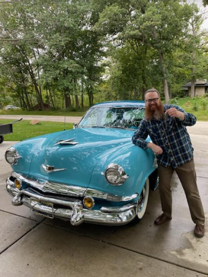 Green poses with his car that he got all the way from South Dakota. 