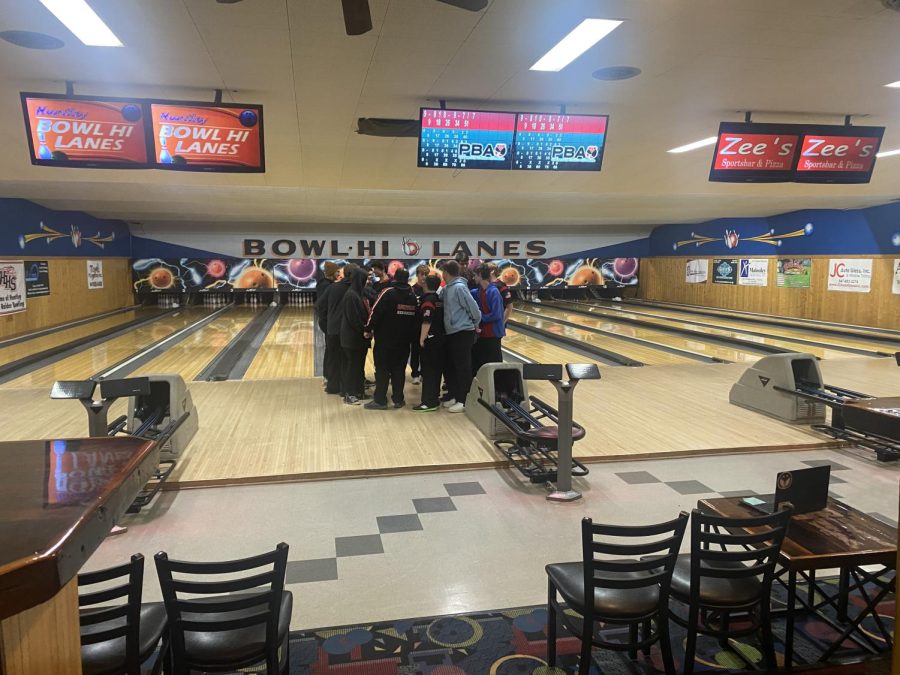 Varsity and JV bowling team gathering together after their meet against Geneva.