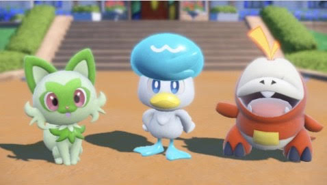 The three starter Pokémon a player can choose at the beginning of the game: Sprigatito, Quaxly, and Fuecoco. 