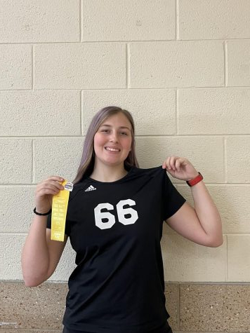 McQueen smiling for a picture after finishing a volleyball tournament over the weekend. She is also excited for the incoming track and field season to begin.