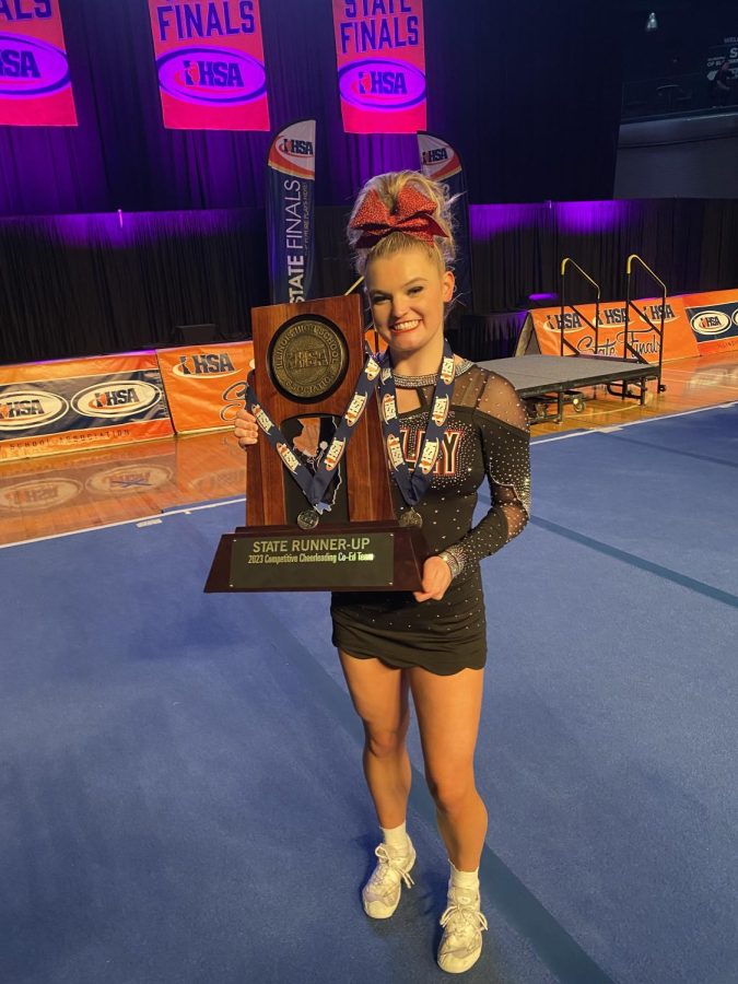 Rabick poses with the teams trophy.